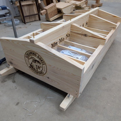 Wooden mineral cart showing the complete wooden structure with bags of loose mineral in each compartment.