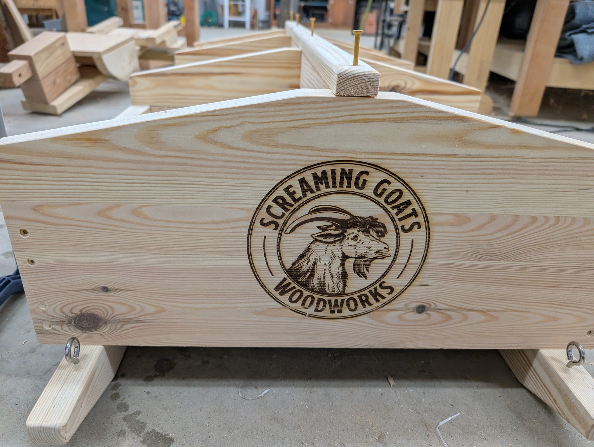 Screaming Goats Woodworks laser engraving on mineral cart and eyelets on sleds