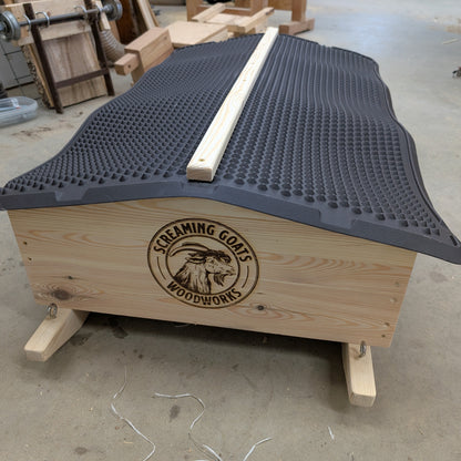 Wooden mineral cart on sleds for rotational grazing. Eyelets can be attached to rope or chain for manual or mechanical towing.
